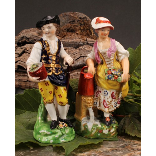 107 - A pair of Derby figures, Gardener and Companion, she stands her right arm on a watering can, he with... 