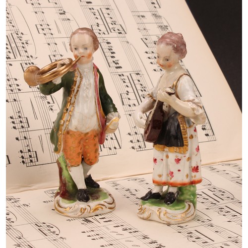 108 - A pair of Derby figures, Musicians, he with a French horn, she with a lute, both standing in 18th ce... 