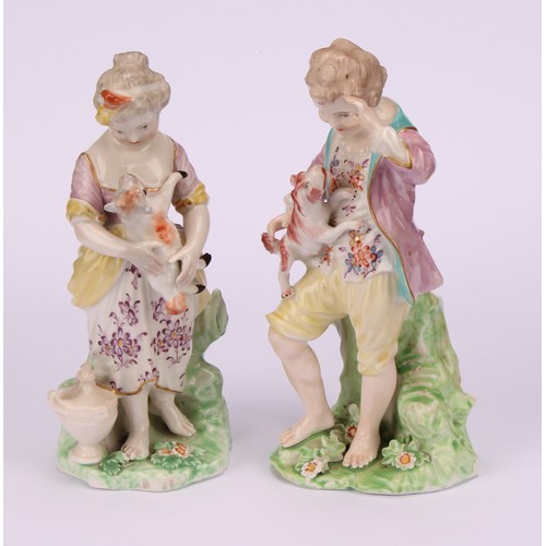 109 - A pair of Derby figures, The French Shepherds, both standing, he with a puppy jumping up his chest, ... 