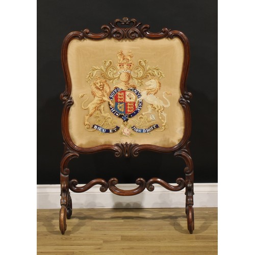 1445 - A Victorian walnut fire screen, Berlin wool work banner worked in coloured threads with the Royal co... 