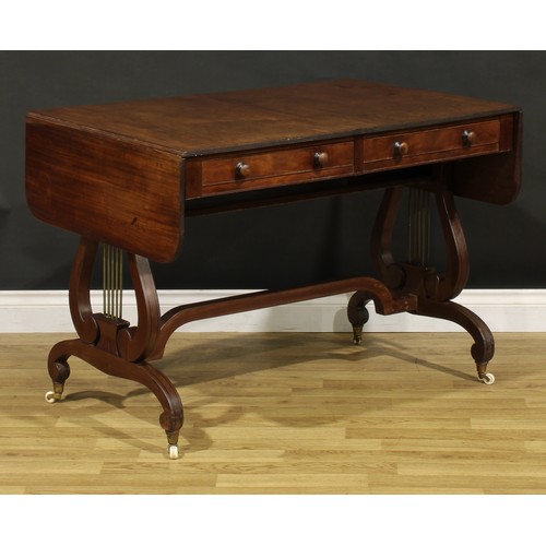 1490 - A 19th century Regency design mahogany sofa table, rounded rectangular top with reeded edge and fall... 