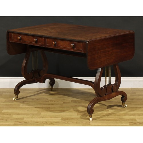 1490 - A 19th century Regency design mahogany sofa table, rounded rectangular top with reeded edge and fall... 