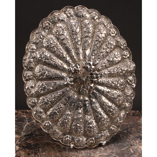 593 - A 19th century Turkish silver mirror, floral border and ground cast in relief, phoenix finial, 27cm ... 