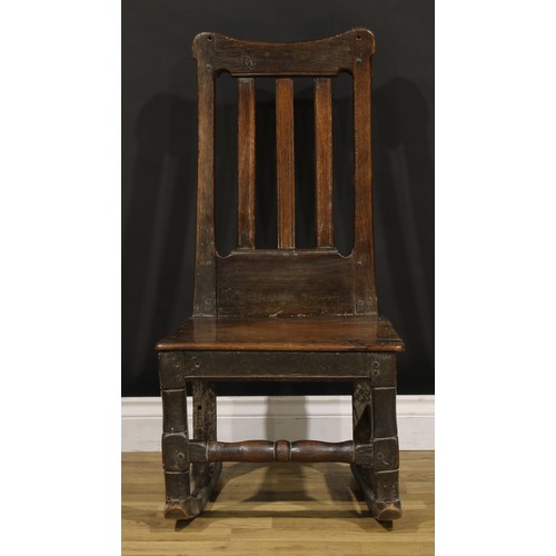 1222 - A Charles II oak side chair, later converted to a rocking chair, plank seat, turned front stretcher,... 