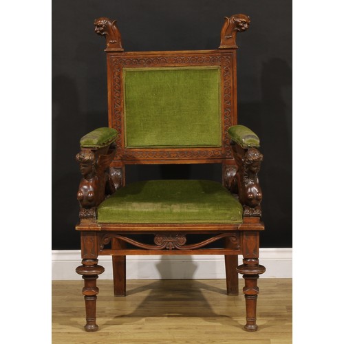 1386 - A 19th century Italian walnut armchair, rectangular back crested by zoomorphic finials, the sculptur... 