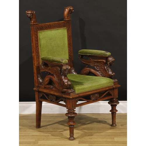 1386 - A 19th century Italian walnut armchair, rectangular back crested by zoomorphic finials, the sculptur... 