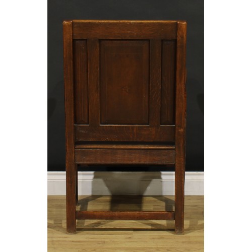 1314 - A 17th century style oak panel back armchair, scroll arms, square legs, 96cm high, 57cm wide, the se... 