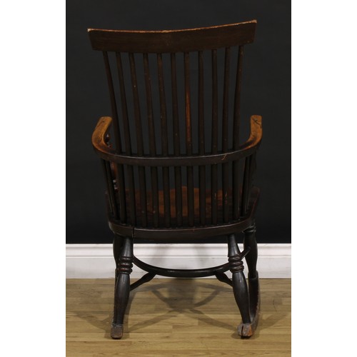 1318 - A 19th century beech, ash and elm comb-back Windsor rocking chair, possibly Scottish, one-piece mid-... 