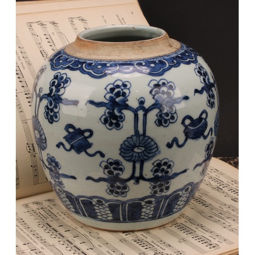 222 - A Chinese porcelain ginger jar, painted in tones of underglaze blue with lotus blooms and characters... 