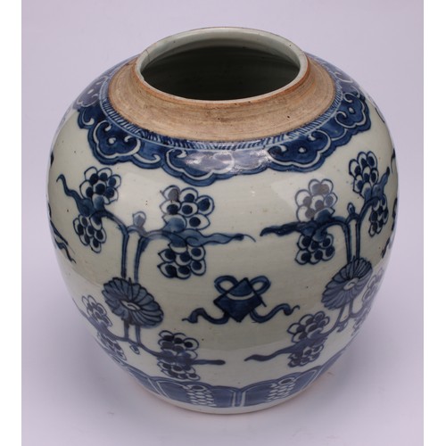 222 - A Chinese porcelain ginger jar, painted in tones of underglaze blue with lotus blooms and characters... 