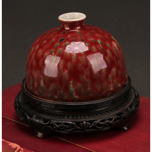 226 - A Chinese taibai zun water pot, mottled tones of red and green glaze, hardwood stand, 15cm high over... 