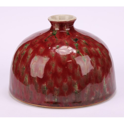 226 - A Chinese taibai zun water pot, mottled tones of red and green glaze, hardwood stand, 15cm high over... 