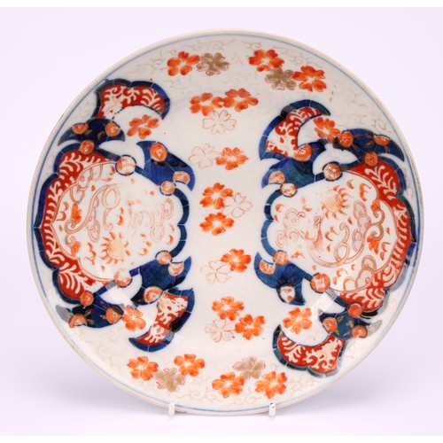 231 - A Japanese dessert service, decorated in the Imari palette with dragons, flowers and traditional mot... 