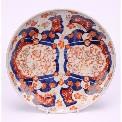 231 - A Japanese dessert service, decorated in the Imari palette with dragons, flowers and traditional mot... 