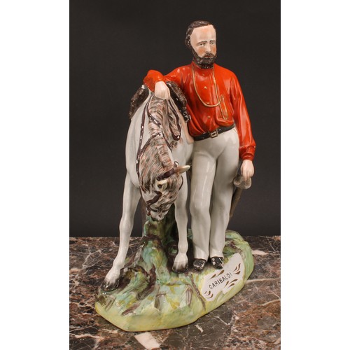 26 - A large 19th century Staffordshire figure, of Garibaldi, modelled standing beside his horse, on a na... 