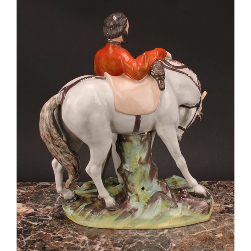 26 - A large 19th century Staffordshire figure, of Garibaldi, modelled standing beside his horse, on a na... 