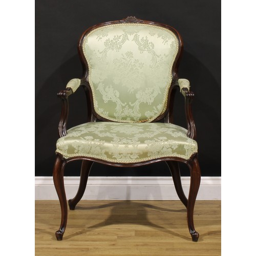 1382 - A 19th century French Hepplewhite design mahogany elbow chair, arched cresting carved with a flower ... 