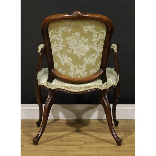 1382 - A 19th century French Hepplewhite design mahogany elbow chair, arched cresting carved with a flower ... 