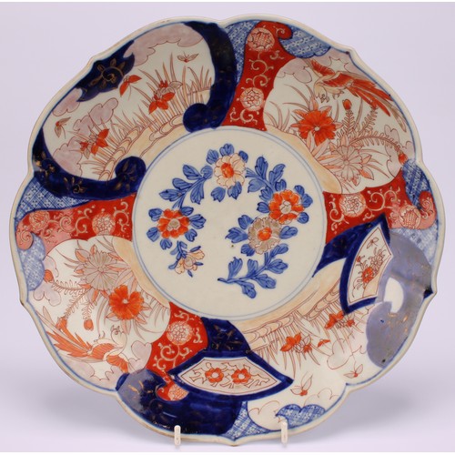 241 - A Japanese shaped circular dish, decorated in the Imari palette, 28.5cm diameter, Meiji period; anot... 