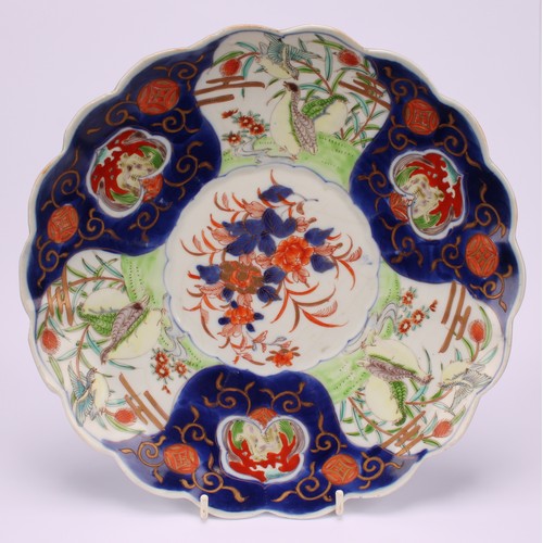 241 - A Japanese shaped circular dish, decorated in the Imari palette, 28.5cm diameter, Meiji period; anot... 