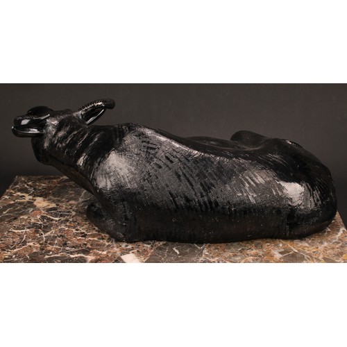 224 - A Chinese silvery-black glazed porcellaneous model, of a recumbent water buffalo, 17cm high, 54cm wi... 