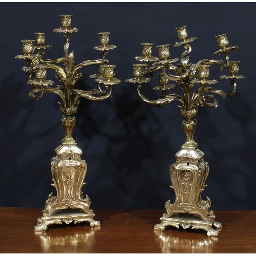 1370 - A pair of large Rococo Revival gilt metal eight-light candelabra, cast throughout with scrolling aca... 