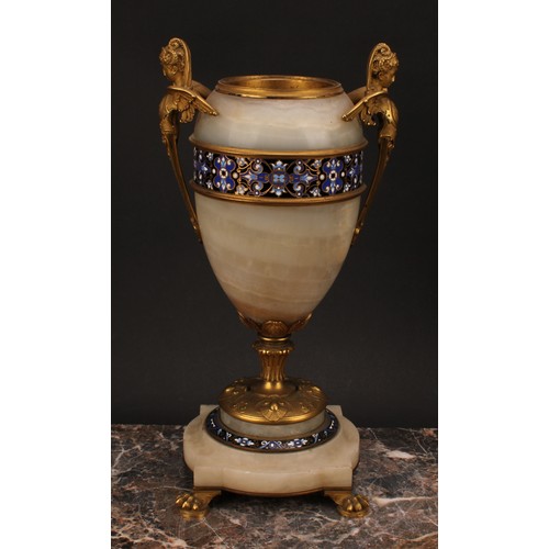 1243 - A pair of late 19th century French gilt bronze and champlevé enamel mounted onyx ovoid urns, the han... 