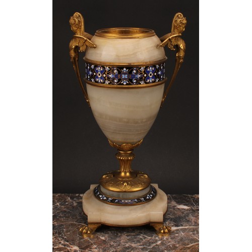 1243 - A pair of late 19th century French gilt bronze and champlevé enamel mounted onyx ovoid urns, the han... 