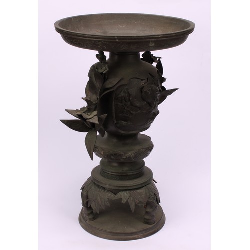 255 - A pair of Japanese bronze usebata or ikebana vases, each cast with birds amongst flora, leafy bamboo... 