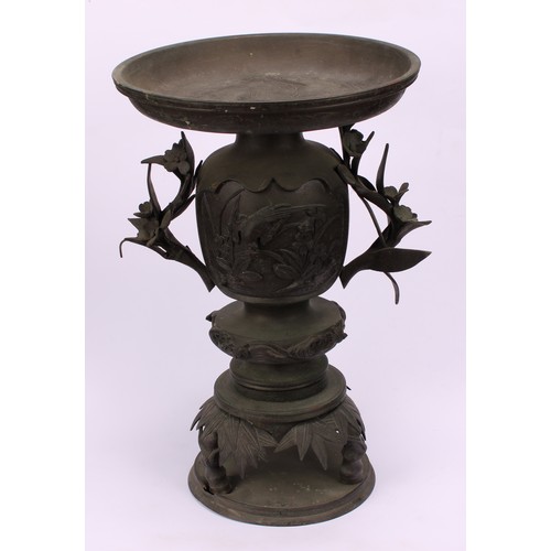 255 - A pair of Japanese bronze usebata or ikebana vases, each cast with birds amongst flora, leafy bamboo... 