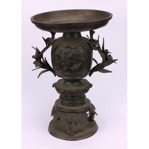 255 - A pair of Japanese bronze usebata or ikebana vases, each cast with birds amongst flora, leafy bamboo... 