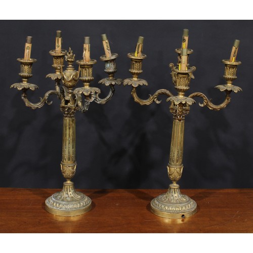 1372 - A pair of Louis XVI Revival ormolu four-light candelabra, each stop-fluted pillar surmounted by a fl... 