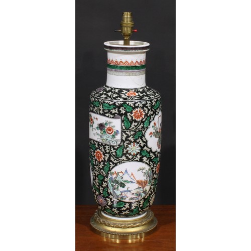 223 - A Chinese rouleau vase, painted in the famille verte palette on a noir ground, later fitted as a lam... 