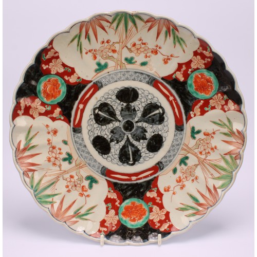 242 - A Japanese shaped circular dish, decorated in the Imari palette, 31.5cm diameter, Meiji period