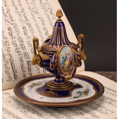 127 - A 19th century Continental gilt metal mounted porcelain inkwell, in the manner of Sèvres, decorated ... 