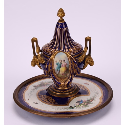 127 - A 19th century Continental gilt metal mounted porcelain inkwell, in the manner of Sèvres, decorated ... 