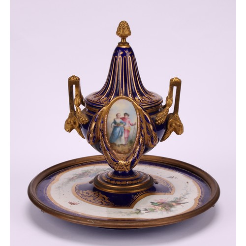 127 - A 19th century Continental gilt metal mounted porcelain inkwell, in the manner of Sèvres, decorated ... 