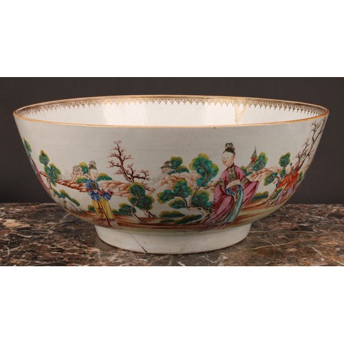 274 - An 18th century Chinese porcelain punch bowl, painted in polychrome with figures of the court and at... 