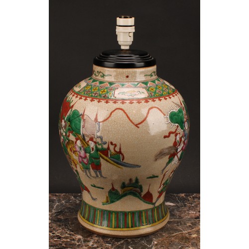 205 - A Chinese crackle glazed baluster vase, painted in polychrome enamels with warriors, four character ... 