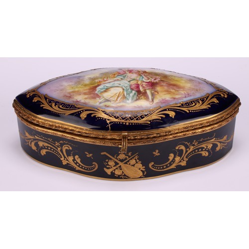 132 - A French porcelain navette shaped casket, hinged cover painted with a courting couple, the border an... 