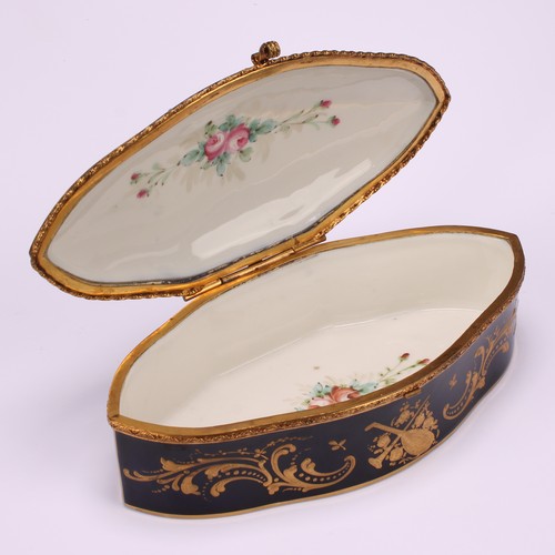 132 - A French porcelain navette shaped casket, hinged cover painted with a courting couple, the border an... 