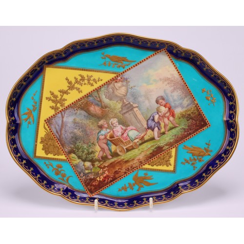 133 - A French porcelain shaped oval cabaret tray, painted with children at play in an Italianate garden, ... 