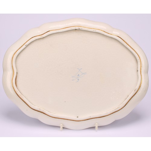 133 - A French porcelain shaped oval cabaret tray, painted with children at play in an Italianate garden, ... 