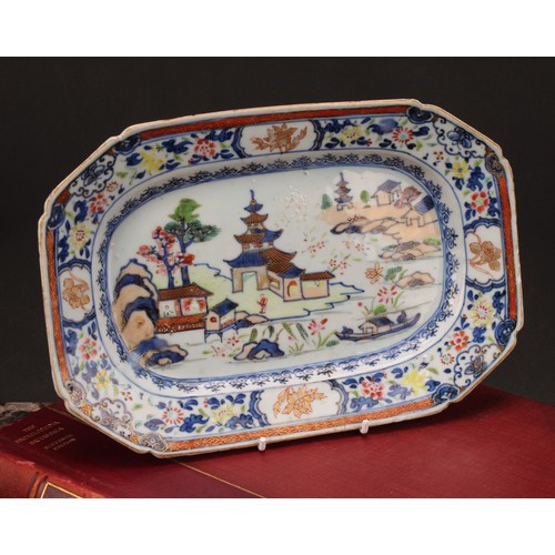 203 - A Chinese canted rectangular plate, decorated in gilt and polychrome with figures in a pagoda landsc... 