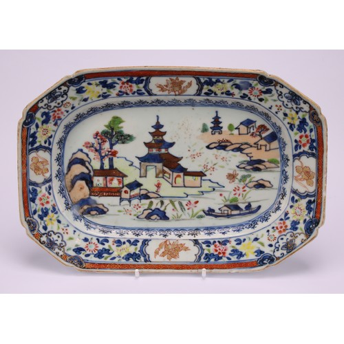 203 - A Chinese canted rectangular plate, decorated in gilt and polychrome with figures in a pagoda landsc... 