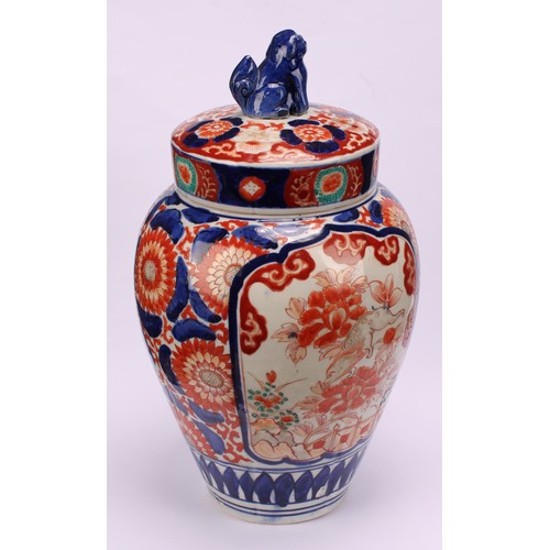 268 - A pair of Japanese ovoid jars and covers, decorated in the Imari palette, 32cm high, Meiji period