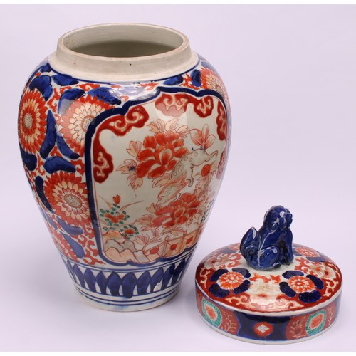 268 - A pair of Japanese ovoid jars and covers, decorated in the Imari palette, 32cm high, Meiji period