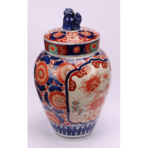 268 - A pair of Japanese ovoid jars and covers, decorated in the Imari palette, 32cm high, Meiji period