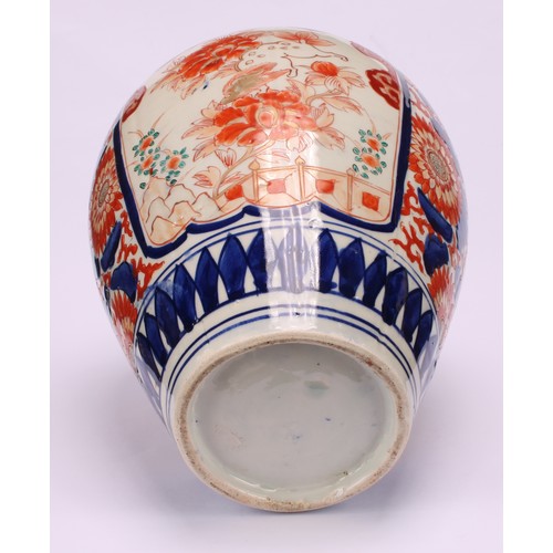 268 - A pair of Japanese ovoid jars and covers, decorated in the Imari palette, 32cm high, Meiji period