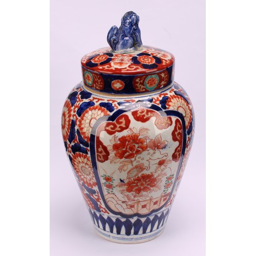 268 - A pair of Japanese ovoid jars and covers, decorated in the Imari palette, 32cm high, Meiji period